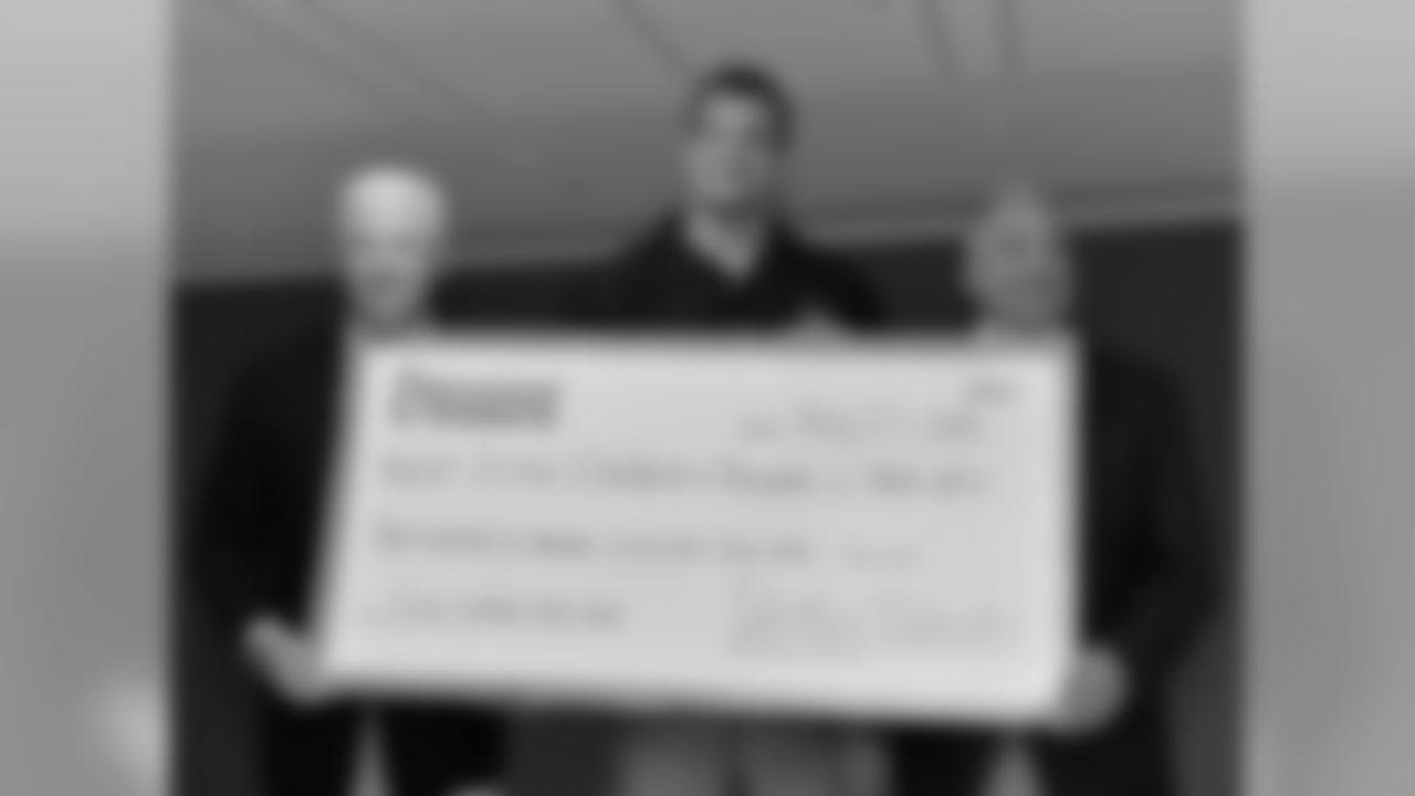 BOSTON, MA - MAY 27: Tom Adie, New England Patriot Rob Gronwkowski and Dick Argys attend Dunkin Donuts Iced Coffee Day check presentation at Boston Children's Hospital on May 27, 2015 in Boston, Massachusetts. (Photo by Paul Marotta/Getty Images for BCH)