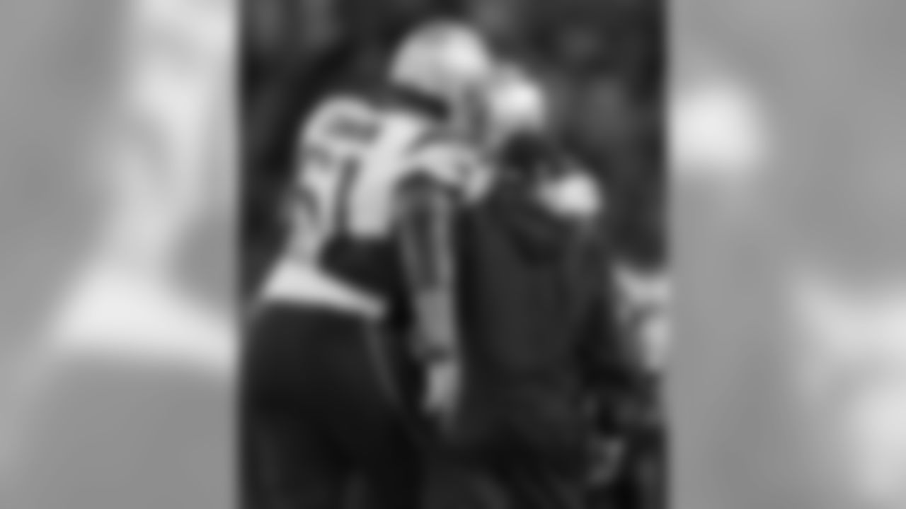 Marcus Cannon talks with OL Coach Dante Scarnecchia