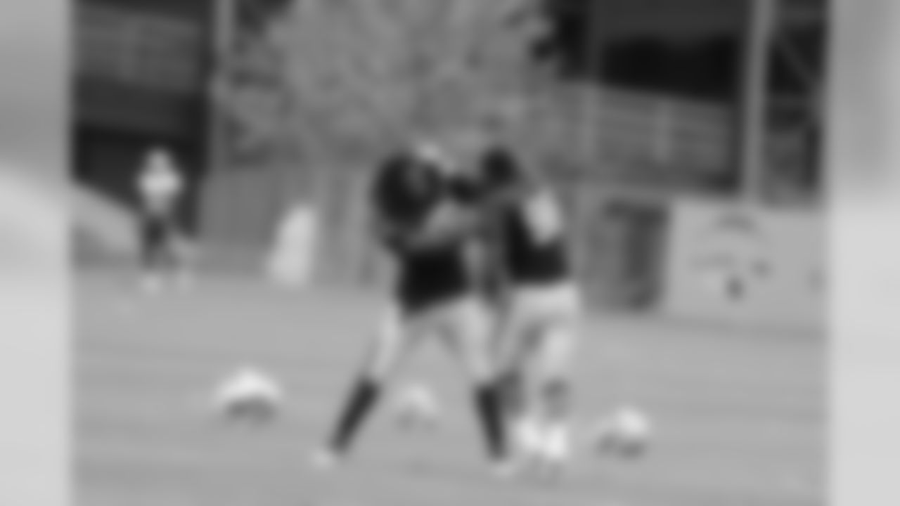 Eric Moore works on pass rush drills at training camp