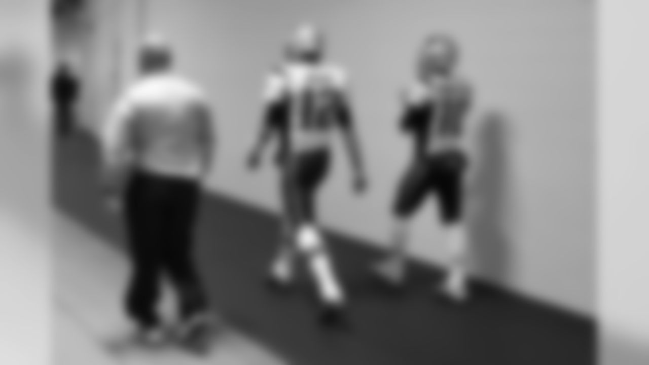 New England Patriots quarterbacks Tom Brady (12) and Jimmy Garoppolo (10) walk to the field before an NFL football game against the Pittsburgh Steelers in Pittsburgh, Sunday, Oct. 23, 2016. (AP Photo/Don Wright)