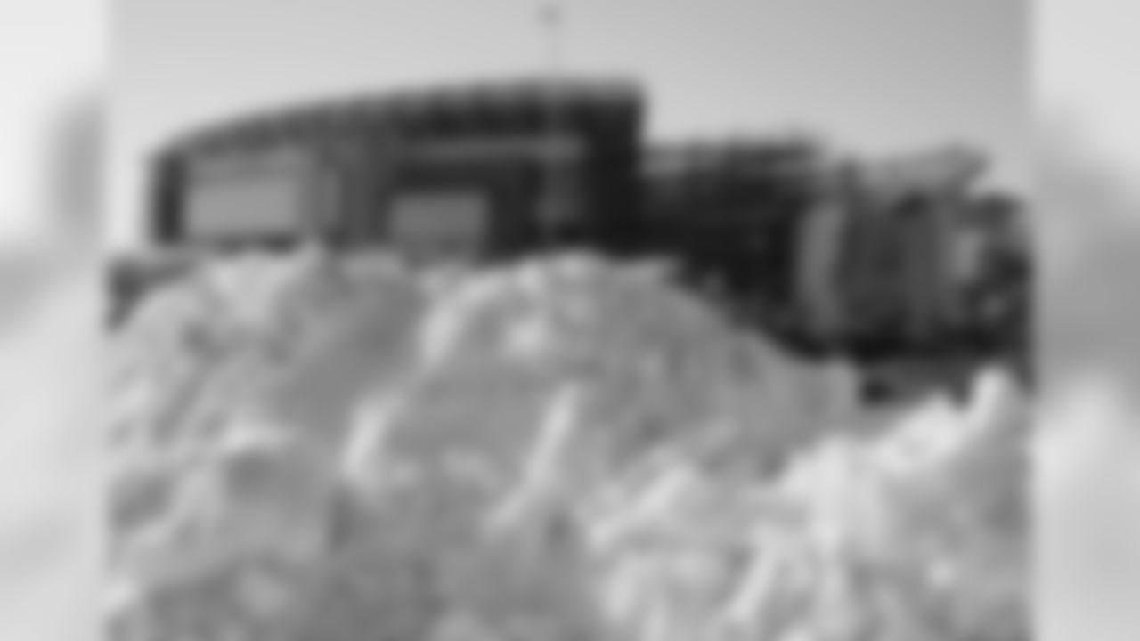 A big pile of snow sits in the parking lot of Gillette Stadium before an NFL football game between the New England Patriots and the New York Jets, Sunday, Dec. 31, 2017, in Foxborough, Mass. (AP Photo/Charles Krupa)