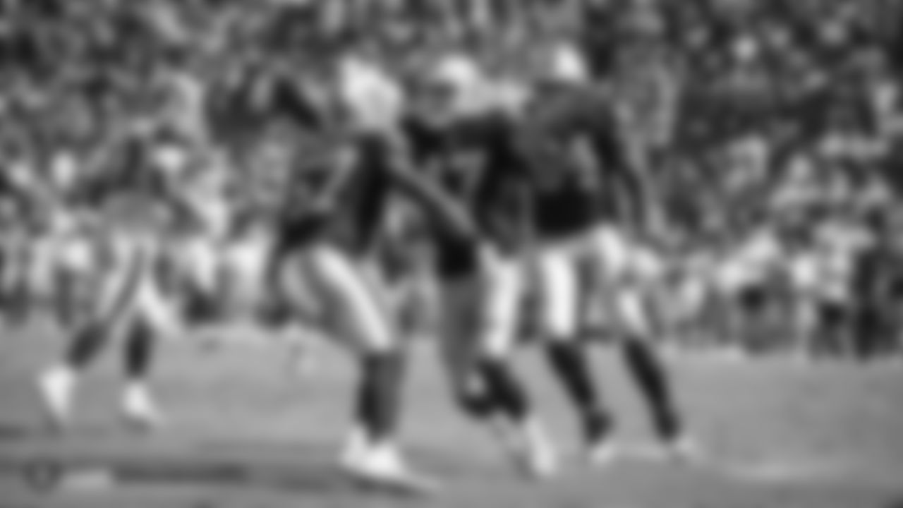 Oakland Raiders linebacker Azeem Victor (57) celebrates with defensive end James Cowser (47) after an interception during The Oakland Raiders preseason game against the Los Angeles Rams at Los Angeles Memorial Coliseum, Saturday, August 18, 2018, in Los Angeles, California. The Oakland Raiders lost 19-15.