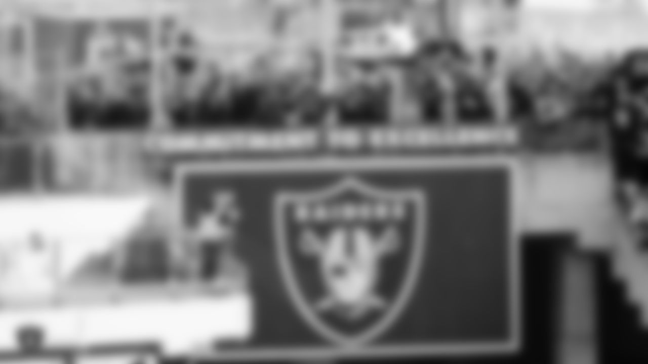 Raiders legend Charles Woodson lights the Al Davis torch before the Raiders regular season game against the Jacksonville Jaguars.