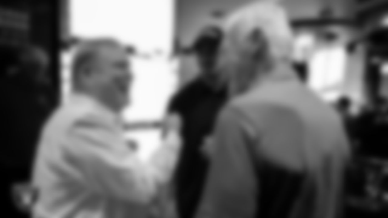 Las Vegas Raiders Owner Mark Davis, linebacker Robert Spillane (41) and alumnus Phil Villapiano speak during an alumni dinner.