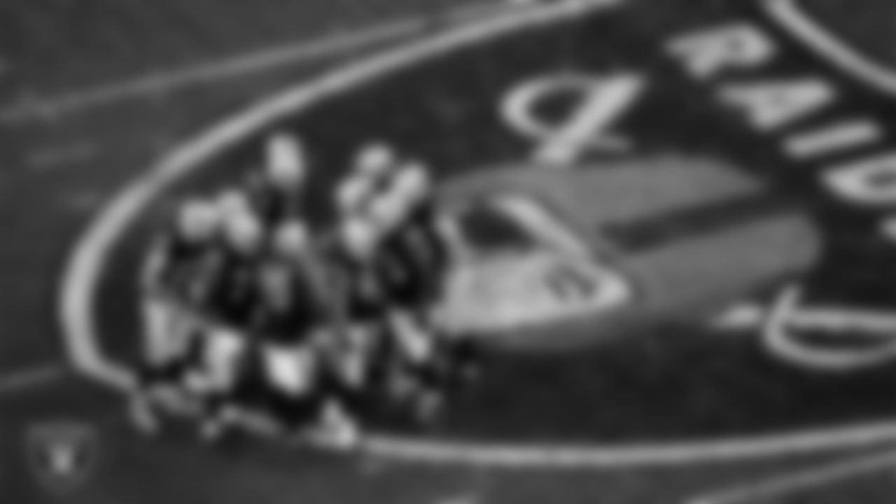 The Las Vegas Raiders offense huddles during the regular season home game against the Los Angeles Chargers.