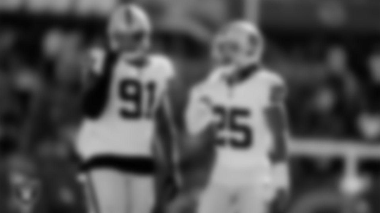 Las Vegas Raiders defensive tackle Bilal Nichols (91) and safety Tre'von Moehrig (25) during the regular season away game against the Chicago Bears at Soldier Field.
