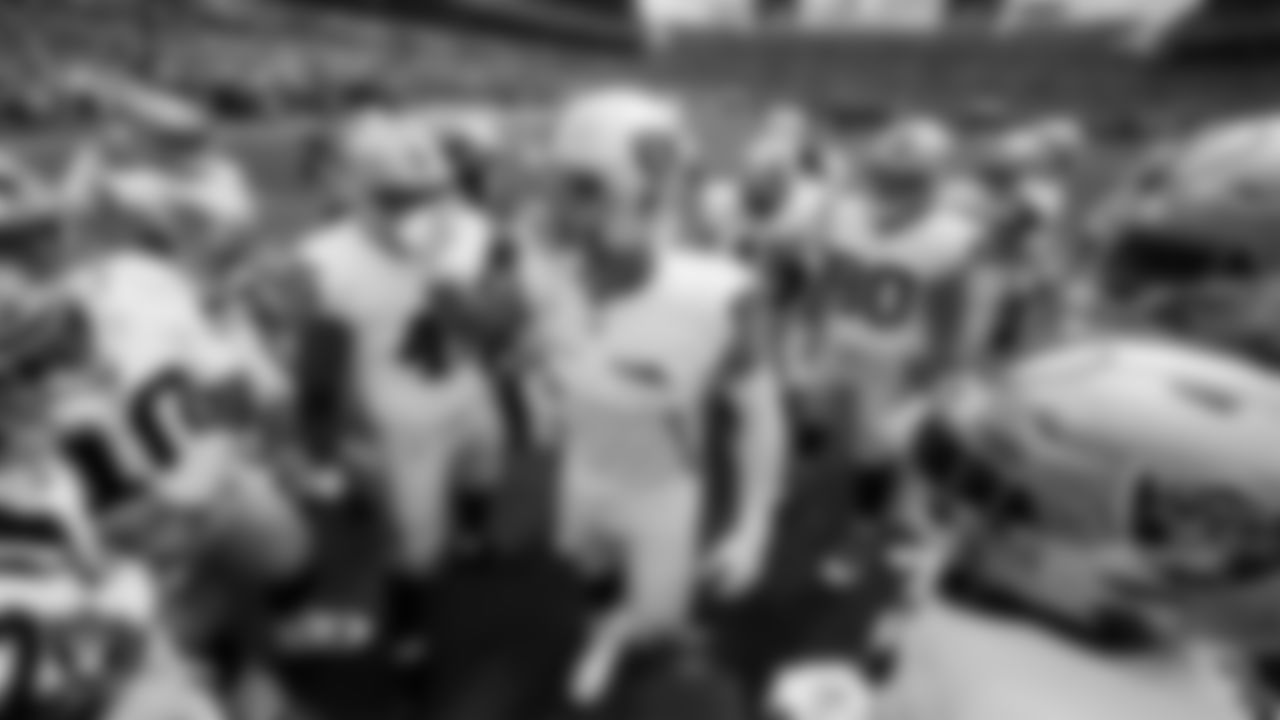Las Vegas Raiders defensive end Maxx Crosby (98) fires the team up in a huddle during warm ups before the regular season away game against the Denver Broncos at Empower Field at Mile High.