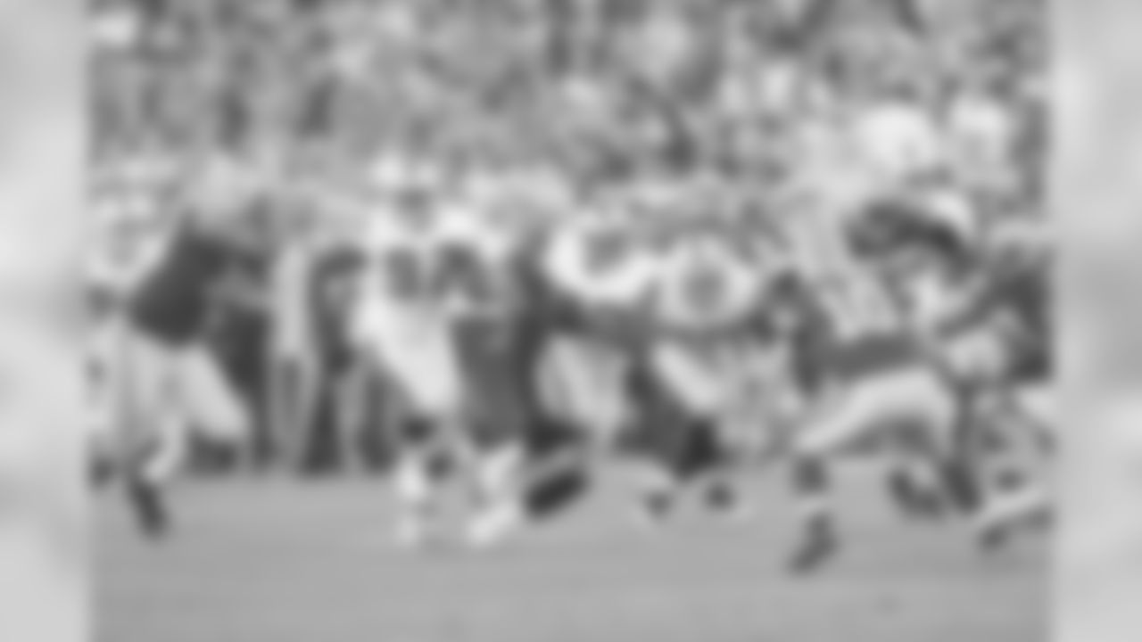 LB Khalil Mack intercepts a pass and returns it upfield during a preseason match-up with the Green Bay Packers.