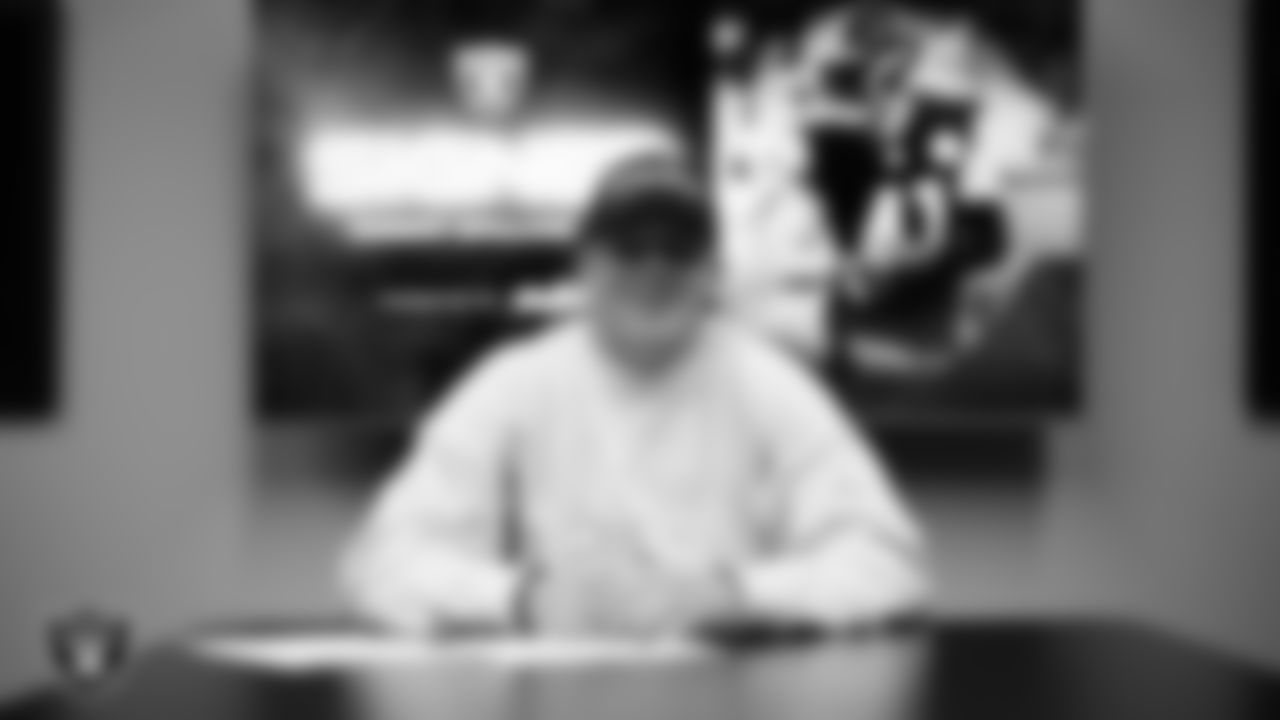Linebacker Robert Spillane signs a contract with the Las Vegas Raiders at the Las Vegas Raiders Headquarters.