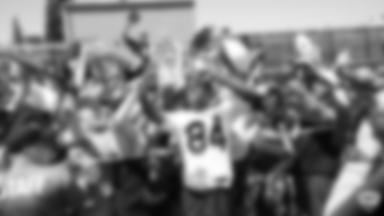 Raiders wide receiver Antonio Brown (84) takes a selfie with fans after practice at 2019 Training Camp.
