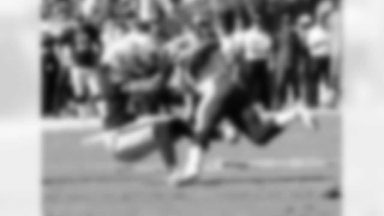 FS Charles Woodson makes the tackle.