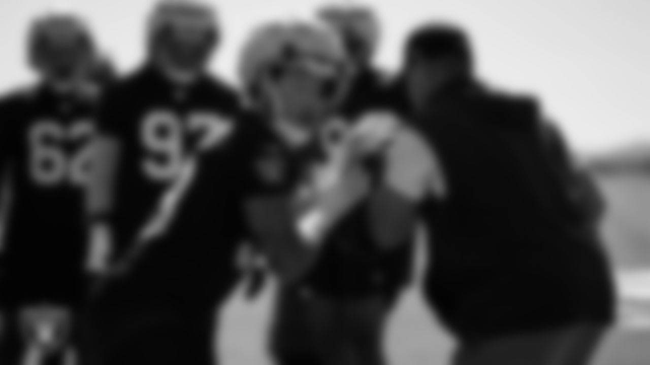 Las Vegas Raiders defensive end Maxx Crosby (98) and defensive assistant and pass rush specialist Matthew Edwards during practice at Intermountain Health Performance Center.