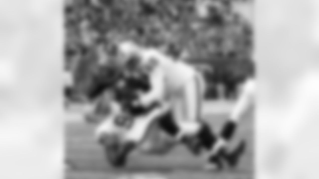 Cincy QB Andy Dalton is taken to the ground by DT Desmond Bryant and LB Rolando McClain.
