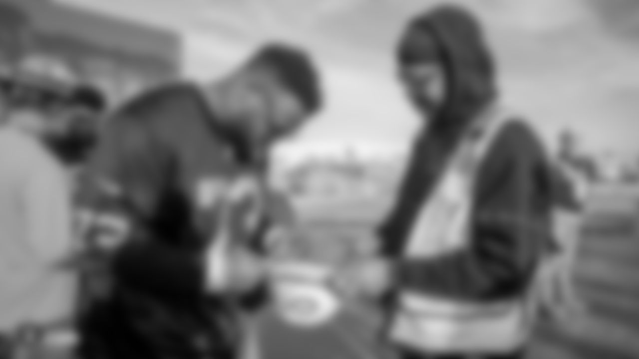 Raiders defensive tackle Maurice Hurst (73) signs an autograph for a construction worker following an official announcement of the Raiders changing their name to the Las Vegas Raiders.
