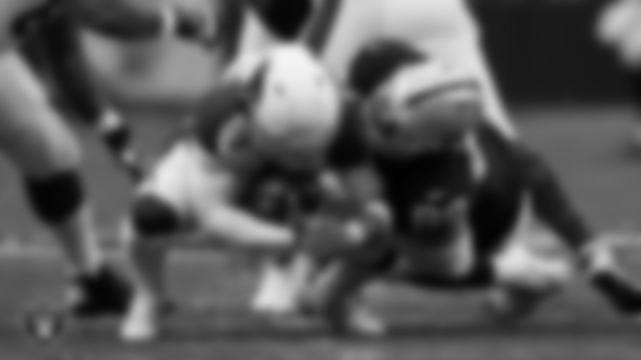 Las Vegas Raiders defensive end Maxx Crosby (98) sacks the quarterback during the regular season home game against the Arizona Cardinals at Allegiant Stadium.