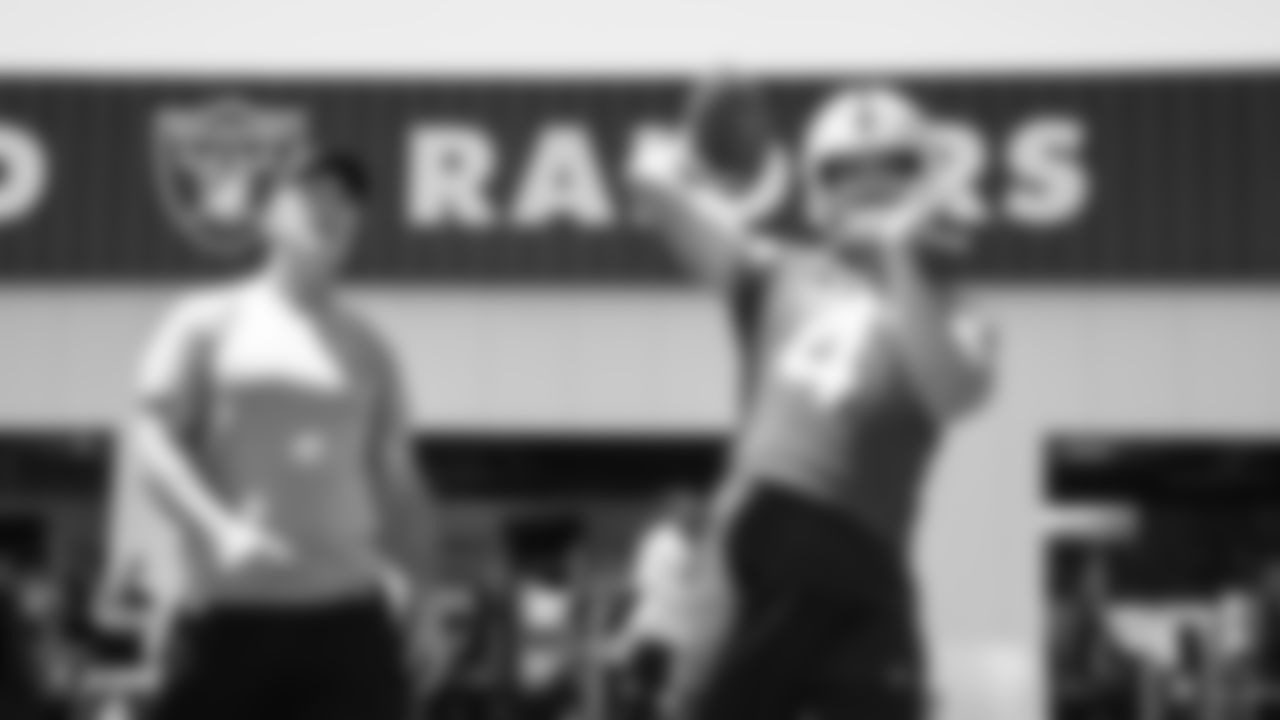 Oakland Raiders alumnus Rich Gannon and quarterback Derek Carr (4) at a Mandatory Mini Camp at the Oakland Raiders Practice Facility, Tuesday, June 12, 2018, in Alameda, California.