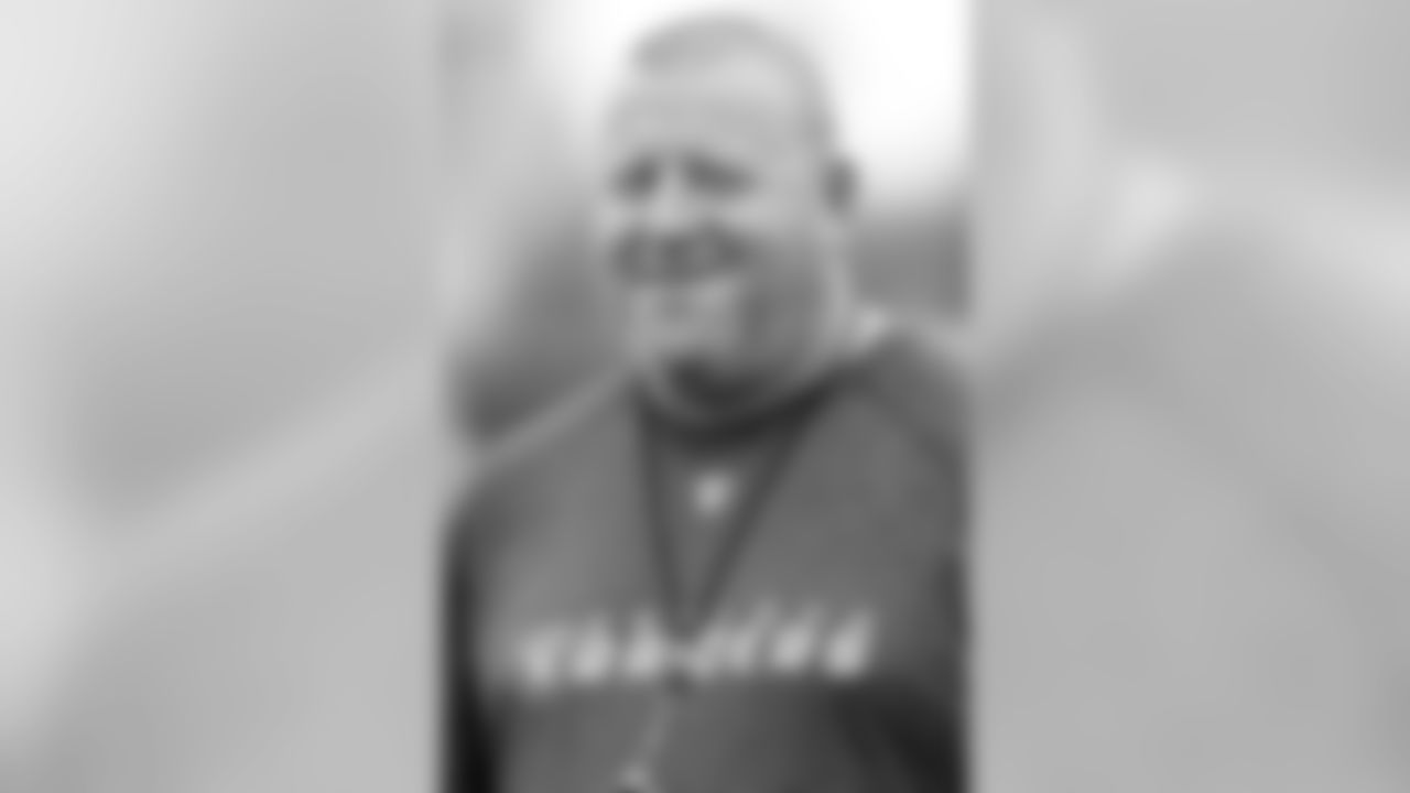 Head Coach Tom Cable smiles during practice. Photo By Tony Gonzales