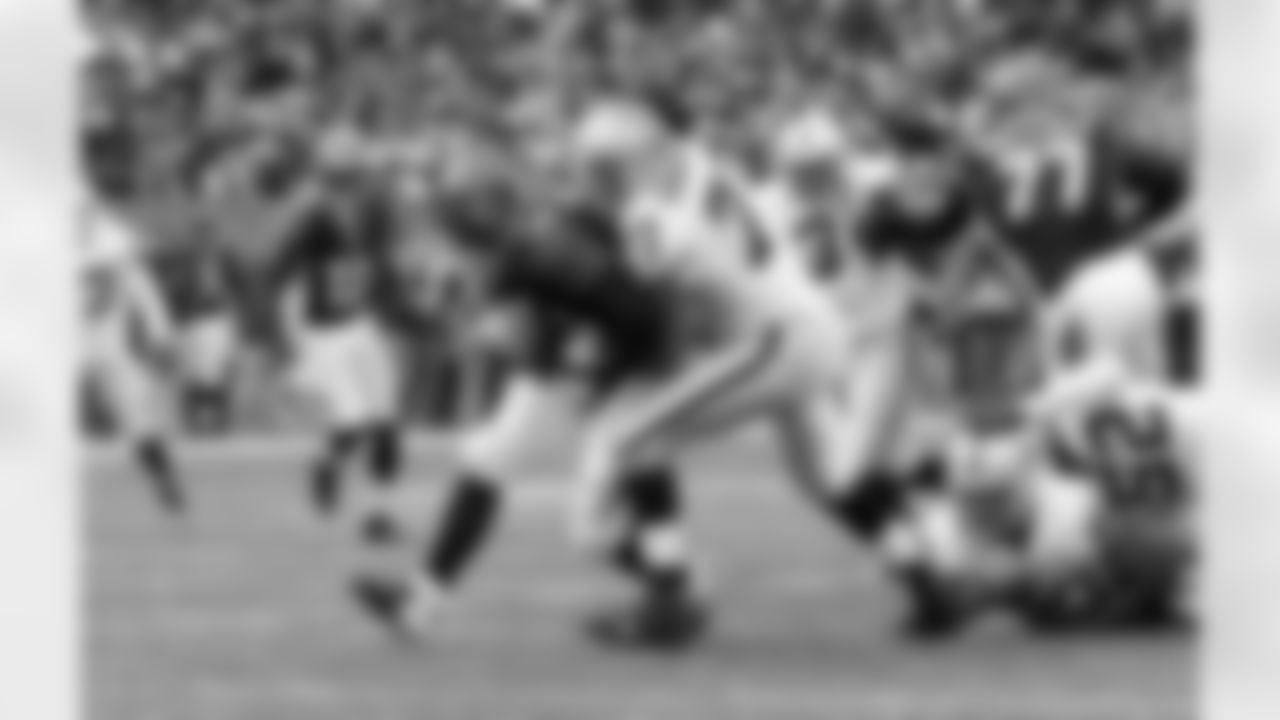 DE Matt Shaughnessy wraps up QB Andy Dalton.