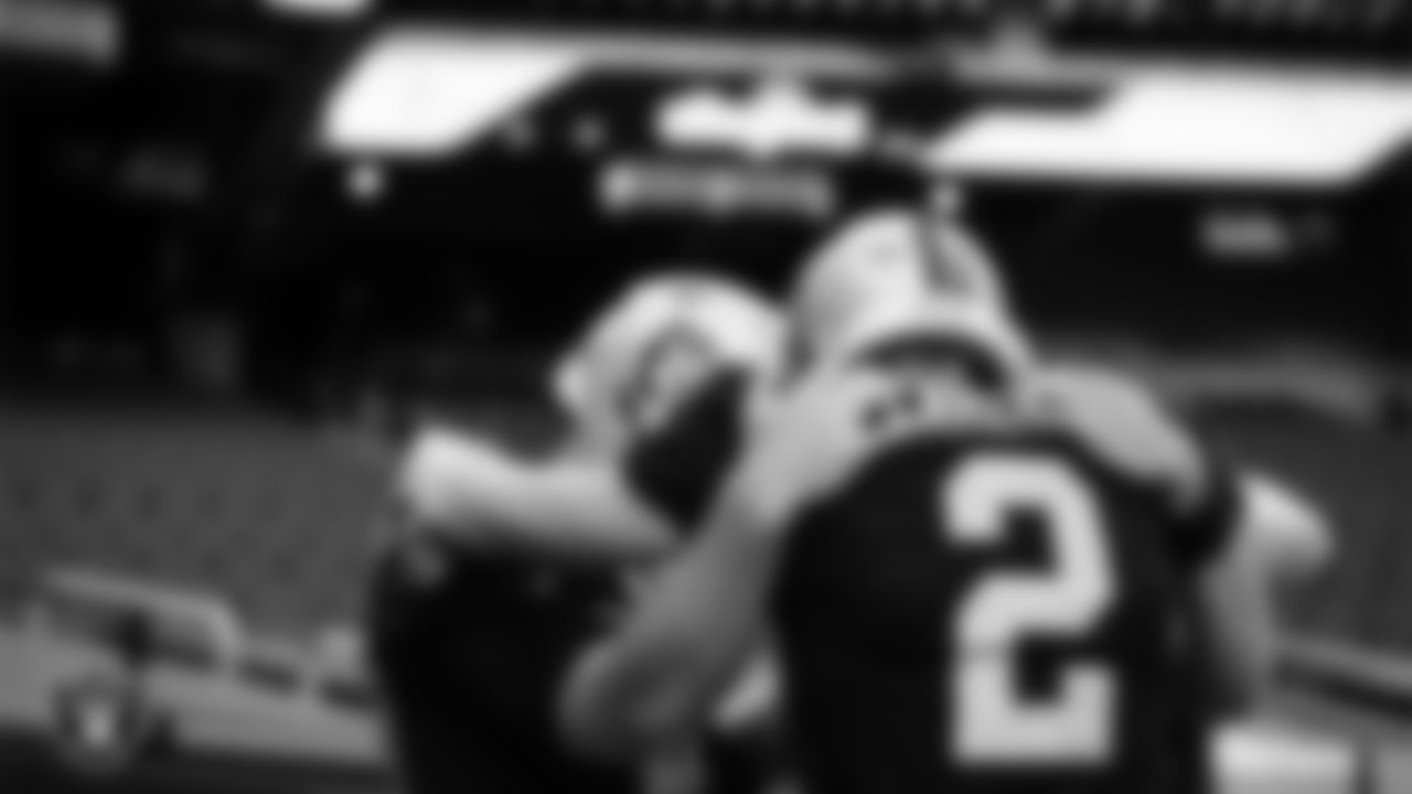 Las Vegas Raiders long snapper Trent Sieg (47), kicker Daniel Carlson (2) and punter AJ Cole (6) huddle before the regular season home game against the Tampa Bay Buccaneers.