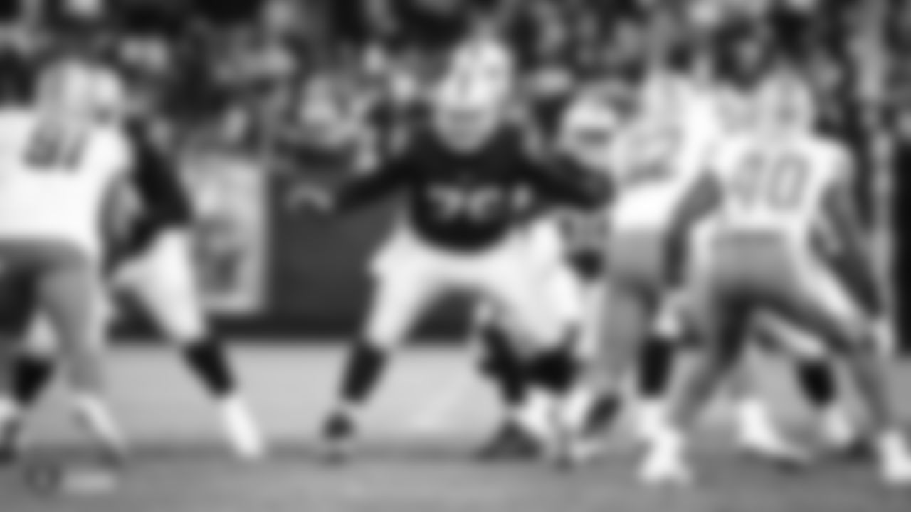 Oakland Raiders offensive guard Jon Feliciano (76) protects quarterback Connor Cook (18) during The Oakland Raiders preseason game against the Detroit Lions at Oakland-Alameda County Coliseum, Friday, August 10, 2018, in Oakland, California. The Oakland Raiders won 16-10.