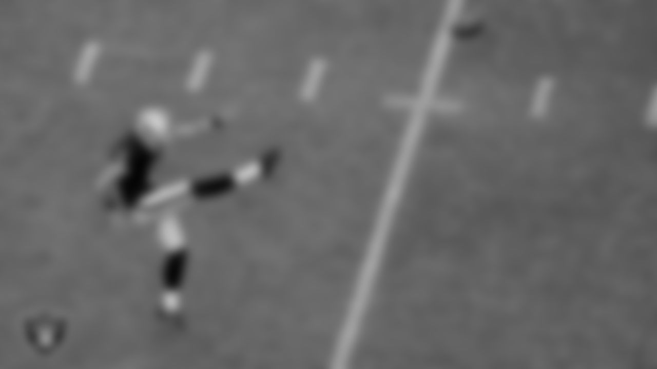 The Raiders warm up before the regular season game against the Denver Broncos at Allegiant Stadium.