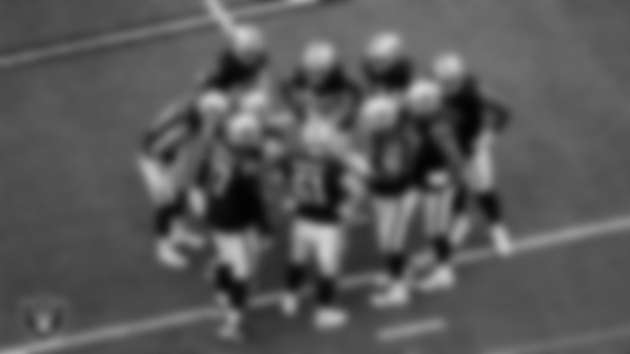 The Las Vegas Raiders huddle during the preseason home game against the San Francisco 49ers at Allegiant Stadium.