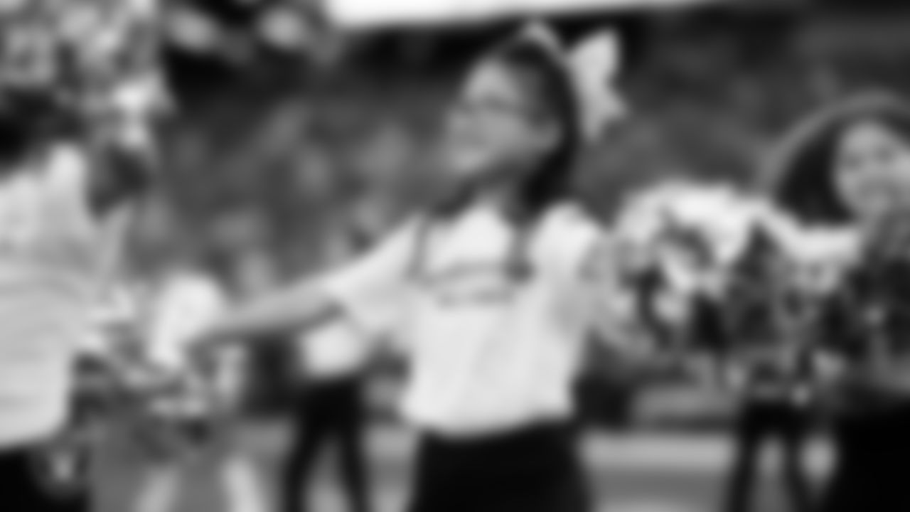 The Raiderettes and Junior Raiderettes perform on the field before the regular season home game against the Los Angeles Chargers at Allegiant Stadium.