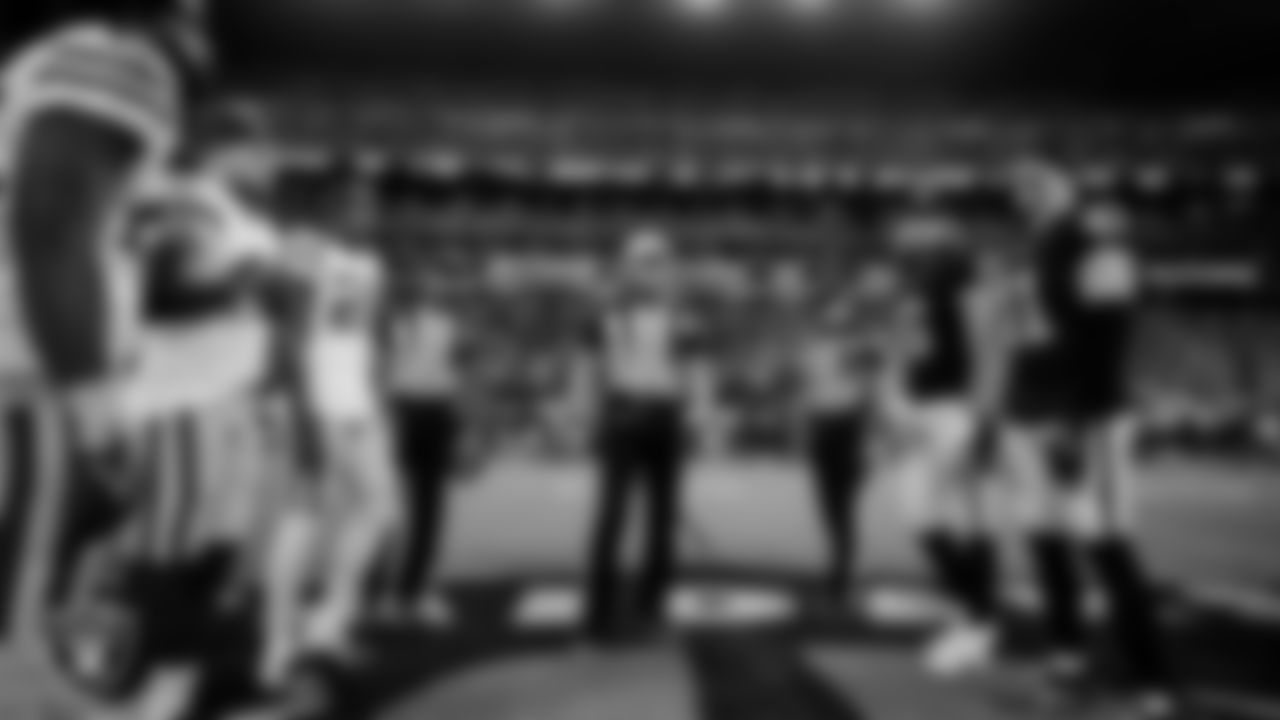 Las Vegas Raiders punter AJ Cole (6) and linebacker Robert Spillane (41) during the coin toss before the regular season home game against the Green Bay Packers at Allegiant Stadium.