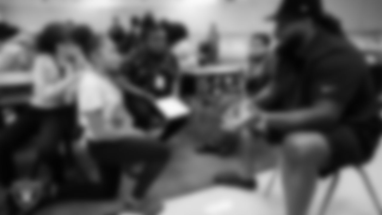 Las Vegas Raiders defensive tackle John Jenkins (95) talks to students during the Hip Hop Entrepreneurship Program Academy at Grant Sawyer Middle School.