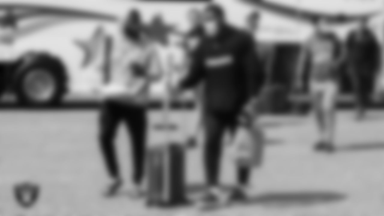 Las Vegas Raiders cornerback Amik Robertson (21) and running back Josh Jacobs (28) depart for the joint training camp practice and preseason away game against the Los Angeles Rams.
