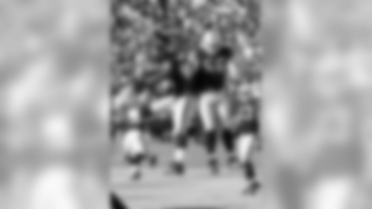 DE Lamarr Houston and LB Miles Burris celebrate a play.