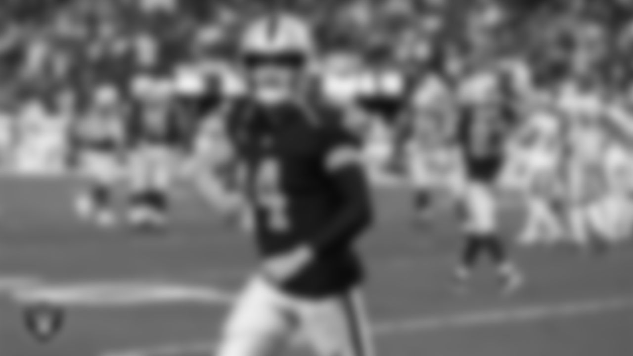 Las Vegas Raiders quarterback Derek Carr (4) celebrates after throwing a 10-yard touchdown pass during the regular season home game against the Baltimore Ravens.