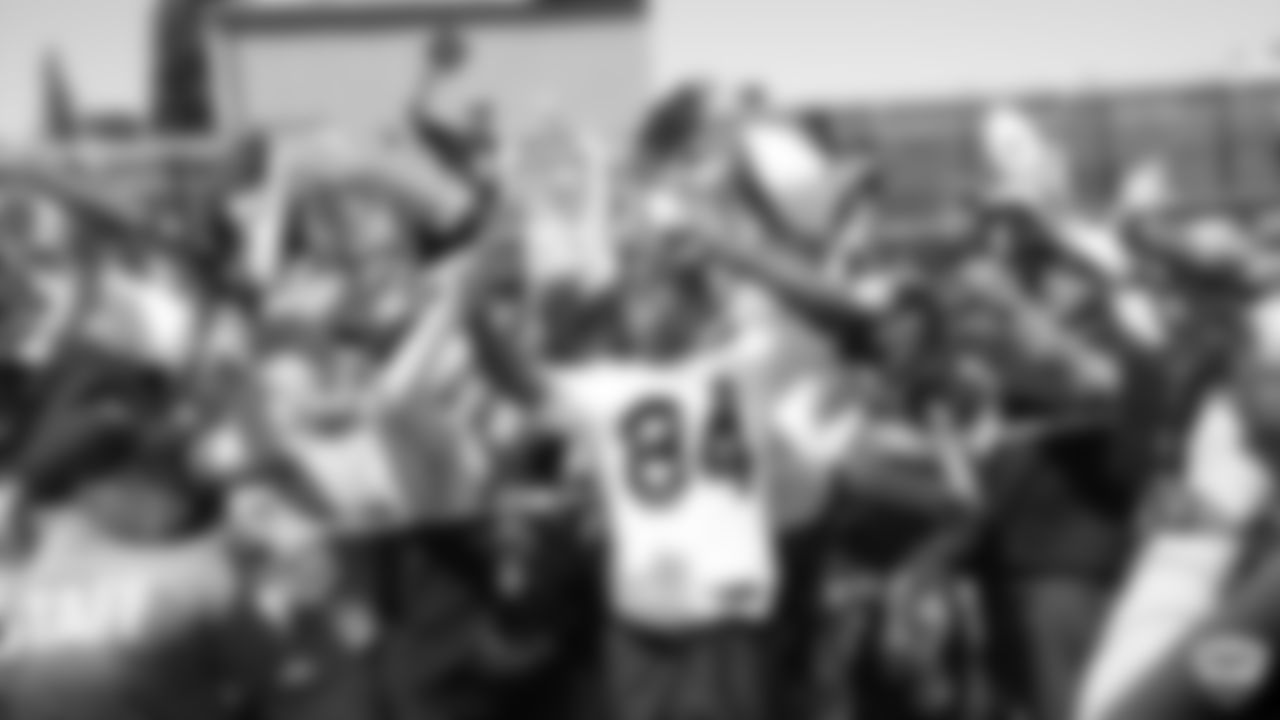 Raiders wide receiver Antonio Brown (84) takes a selfie with fans after practice at 2019 Training Camp.