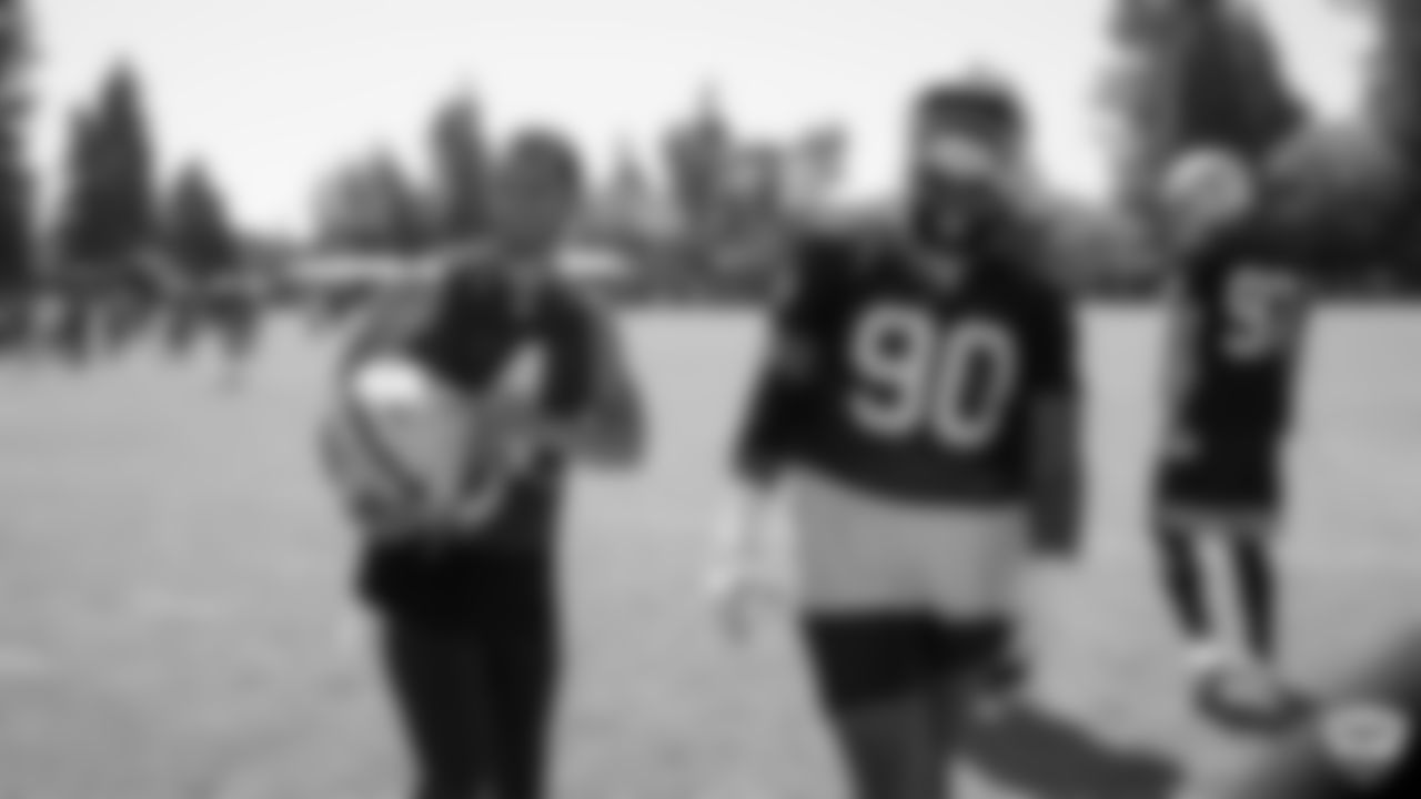 Oakland Raiders quarterback Derek Carr (4) and defensive tackle Johnathan Hankins (90) on the field for practice at 2019 Training Camp.