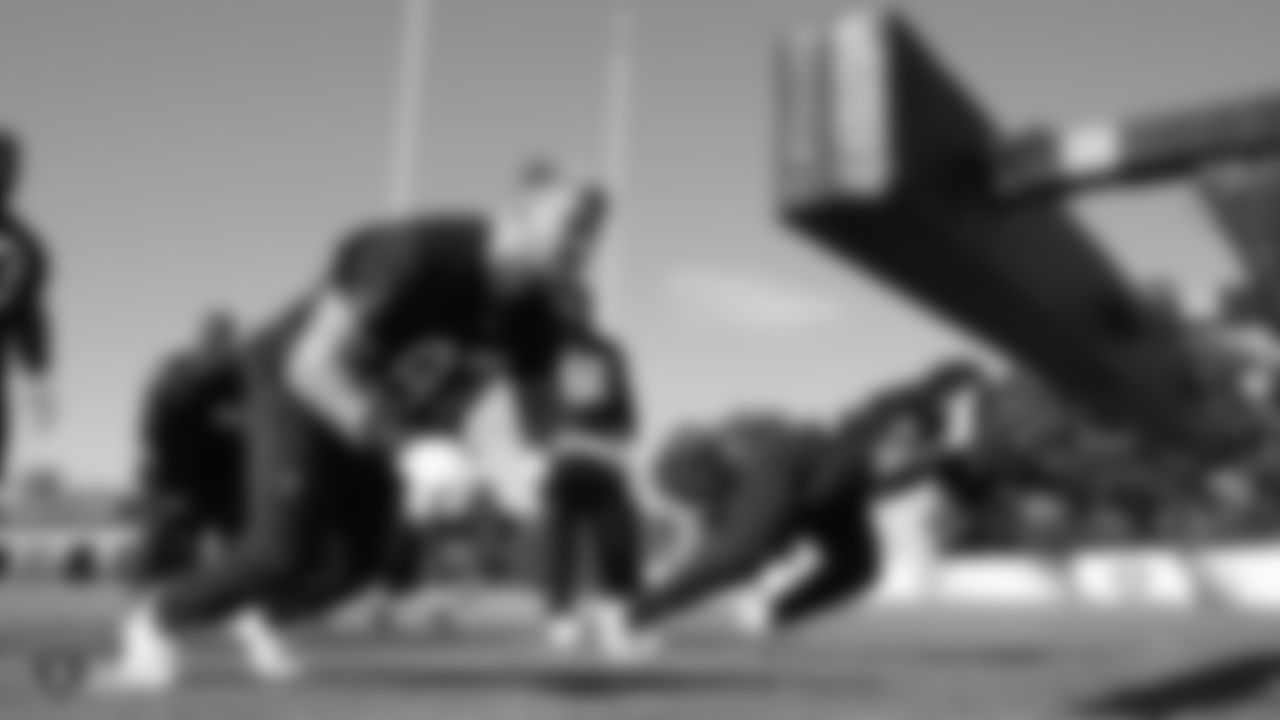 ]Raiders defensive end Josh Mauro (97) and defensive tackle P.J. Hall (92) on the field for practice.