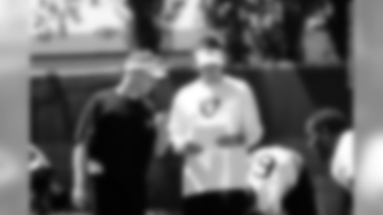 Defensive coordinator Jason Tarver goes over the plan with Head Coach Dennis Allen.