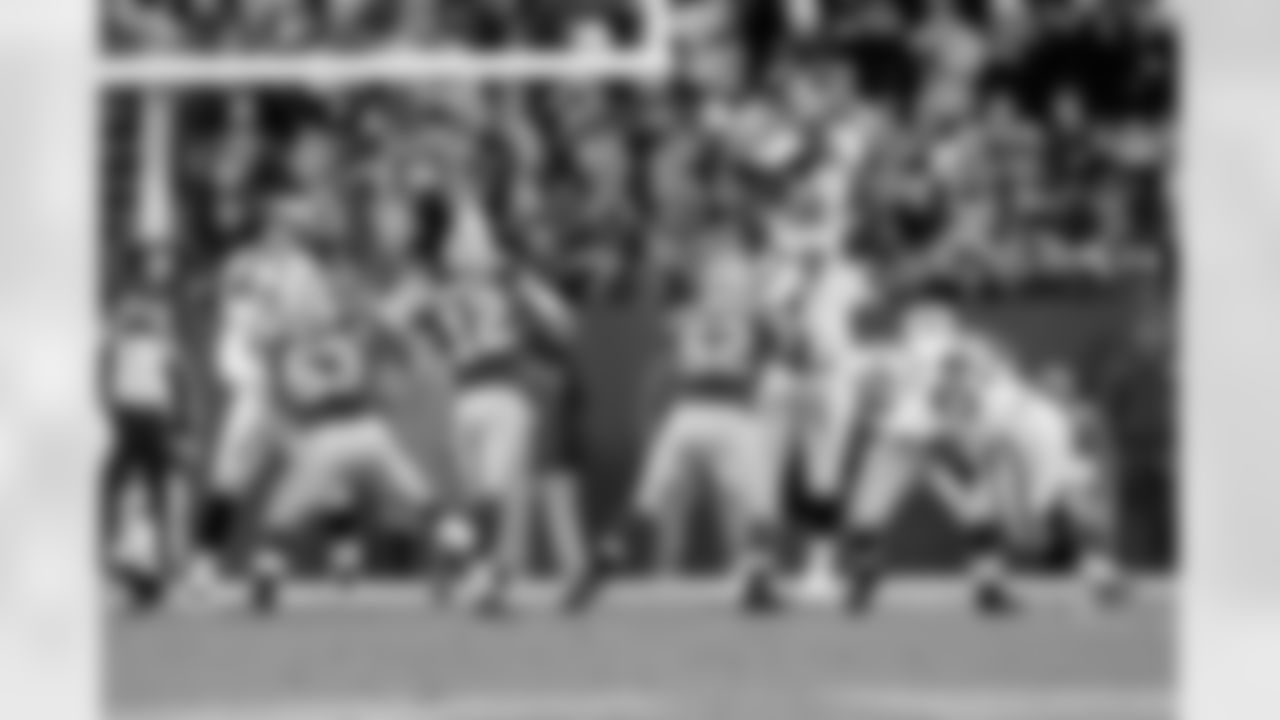 DT John Henderson gets his hands up to try to block Rodgers' pass.