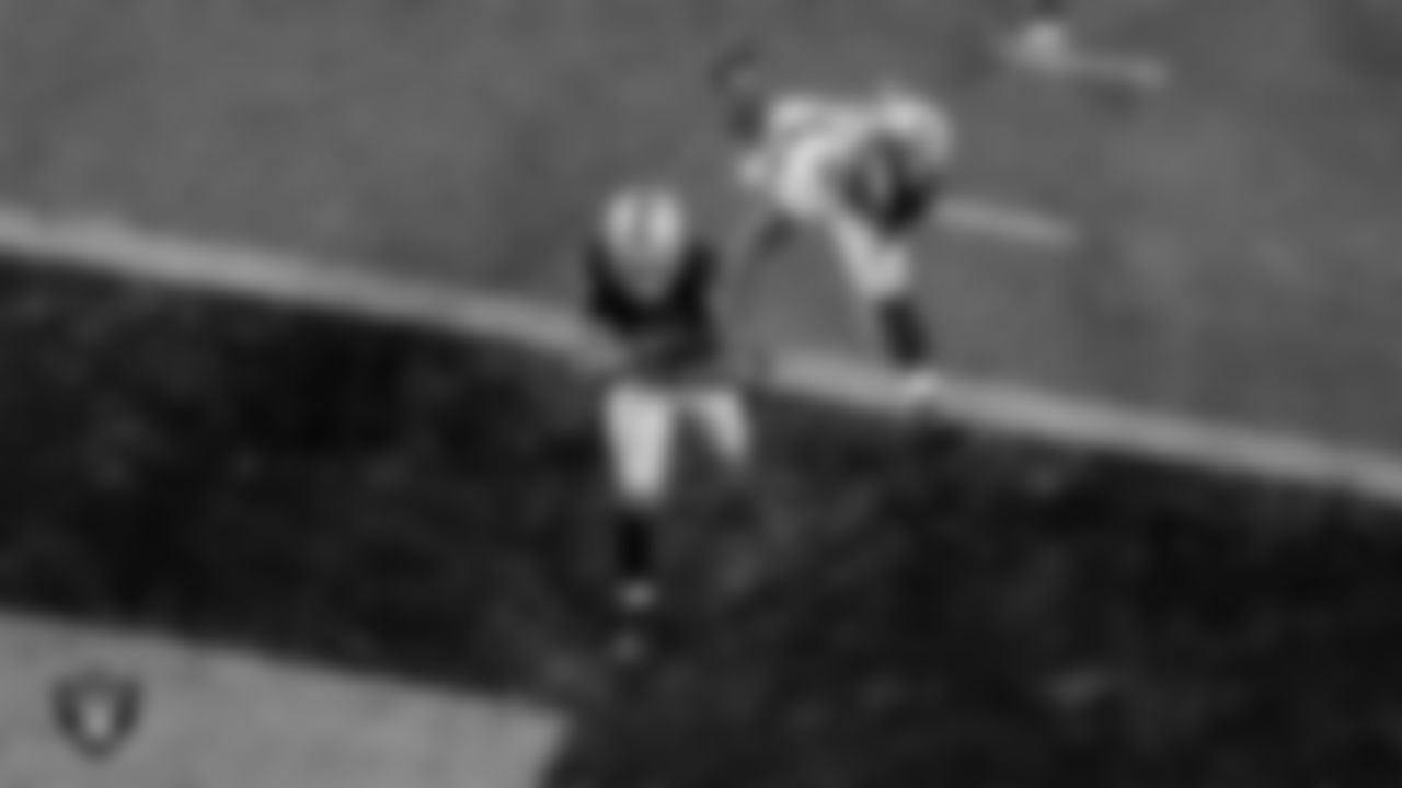 Las Vegas Raiders running back Devontae Booker (23) rushes for a 23-yard touchdown during the regular season game against the Denver Broncos at Allegiant Stadium.