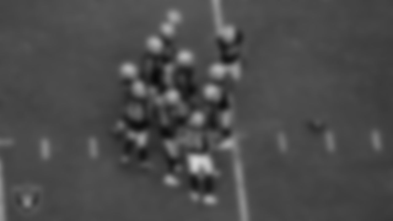 The Las Vegas Raiders defense huddles during the preseason home game against the New England Patriots at Allegiant Stadium.