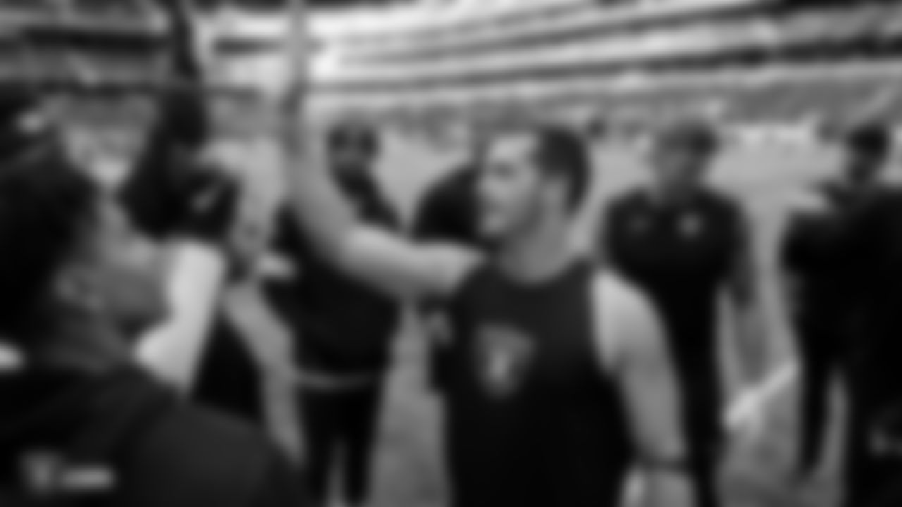 The Raiders huddle up before their game against the Chicago Bears at Tottenham Hotspur Stadium.