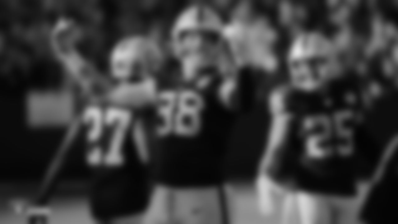 Raiders defensive end Maxx Crosby (98) pumps up the crowd during the regular season game against the Detroit Lions.