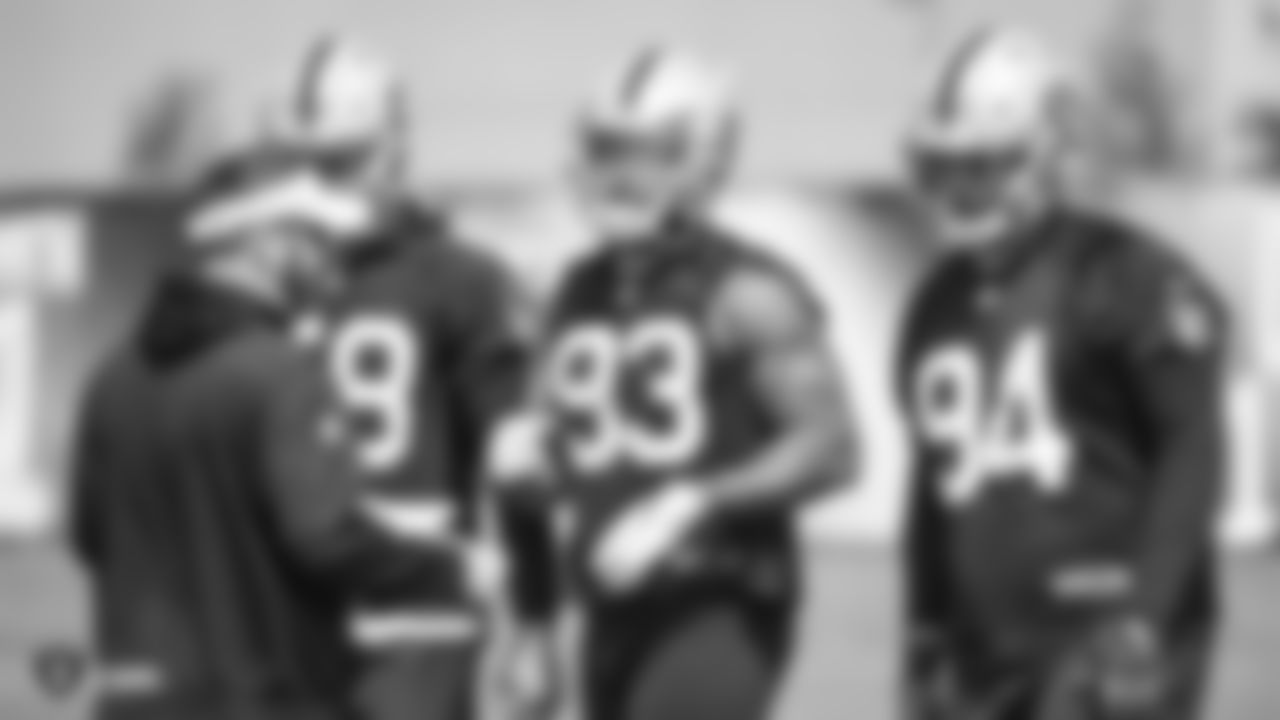 Raiders linebackers coach David Lippincott, linebacker Kyle Wilber (58), defensive end Alex Barrett (93), and defensive tackle Eddie Vanderdoes (94) at an Organized Team Activity (OTA) at the Raiders Practice Facility in Alameda, Calif.