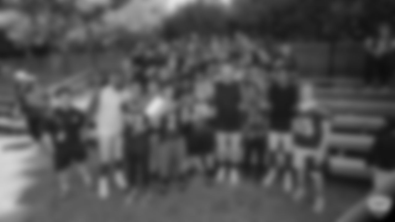 Raiders defensive end Josh Mauro (97), defensive tackle Maurice Hurst (73) and wide receiver Tyrell Williams (16) with High school Football team after a joint practice with the Los Angeles Rams at 2019 Training Camp.