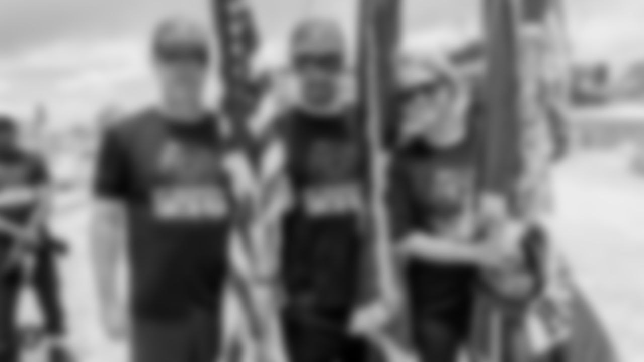 The Southern Nevada Law Enforcement Torch Run partners with the Raiders, represented by alumni Jerry Robinson and Steve Wisniewski, and the Raiderettes, to support Special Olympics Nevada by spending time with its runners and athletes at a fun-filled pit stop along the run.