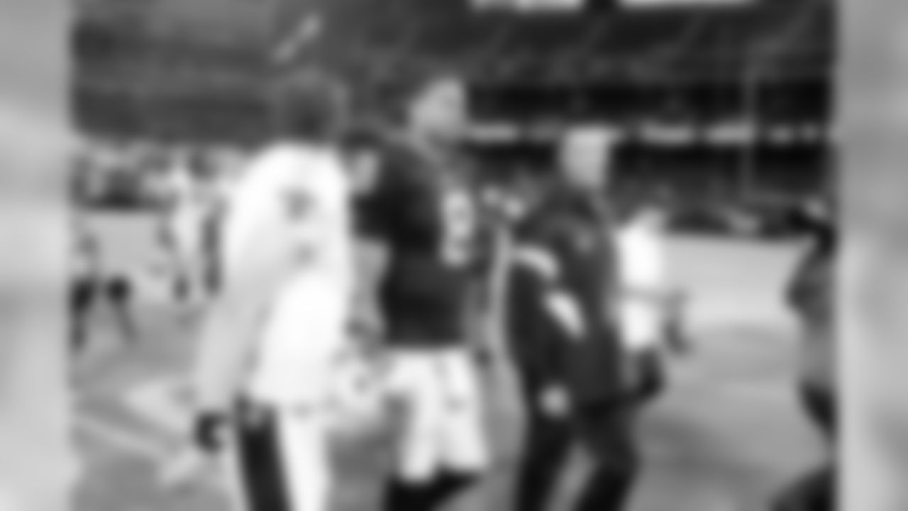 QB Jason Campbell walks off the field with Saints QB Drew Brees after the game.