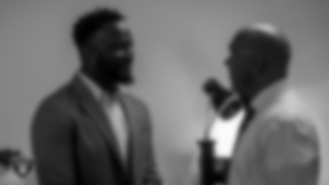 Las Vegas Raiders Senior Vice President and Chief of Staff Marcel Reece speaks with Las Vegas Metropolitan Police Department Sergeant Donald Ruberio.
