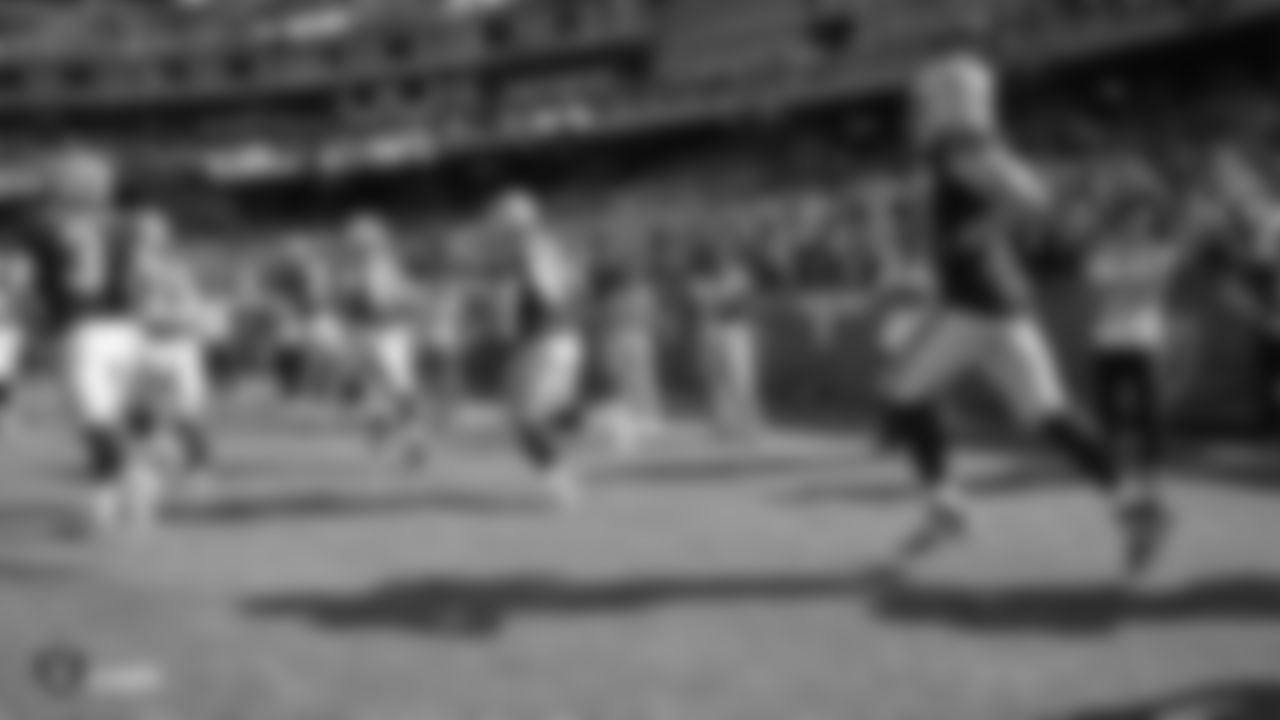 Oakland Tech High School football team on the field as the Raiders are introduced before their preseason game against the Los Angeles Rams.