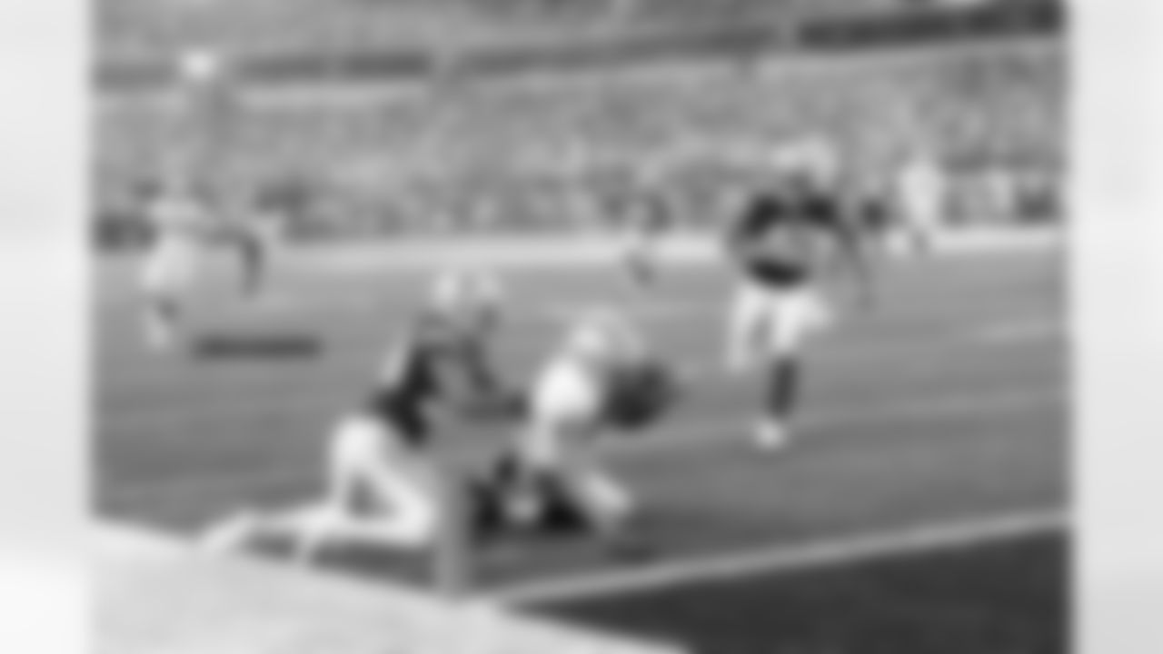 WR Andre Holmes tries to reach across the goal line for the touchdown.