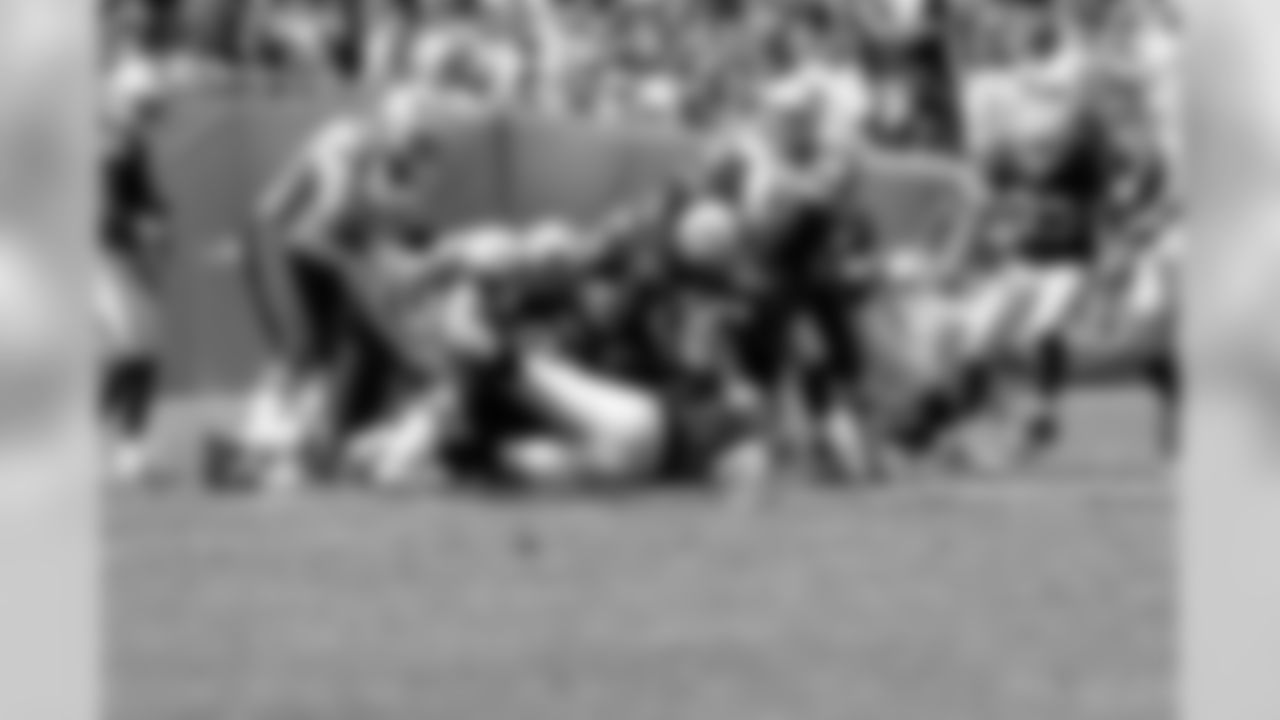 The Raiders defense pile up to stop the Patriots offense.