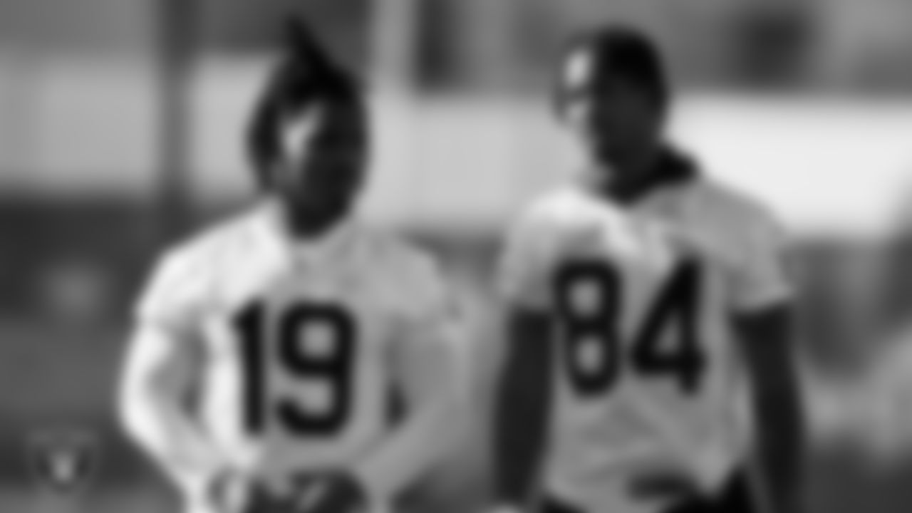 Las Vegas Raiders wide receiver DJ Turner (19) and wide receiver Tyron Johnson (84) at a workout during phase two of the offseason program.